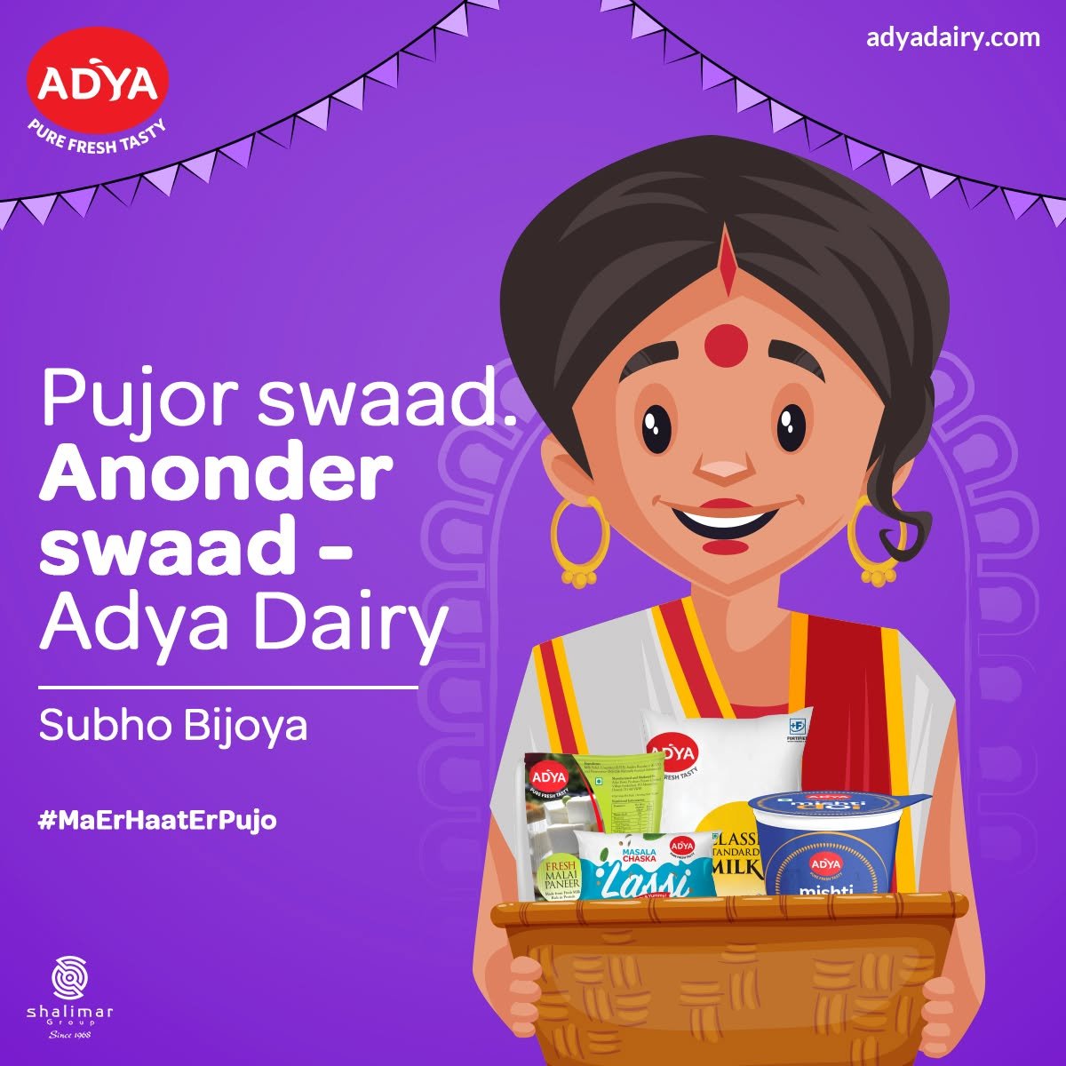 Adya Dairy Subho Bijoya greeting featuring an illustrated Bengali woman holding a basket of dairy products against a purple background.