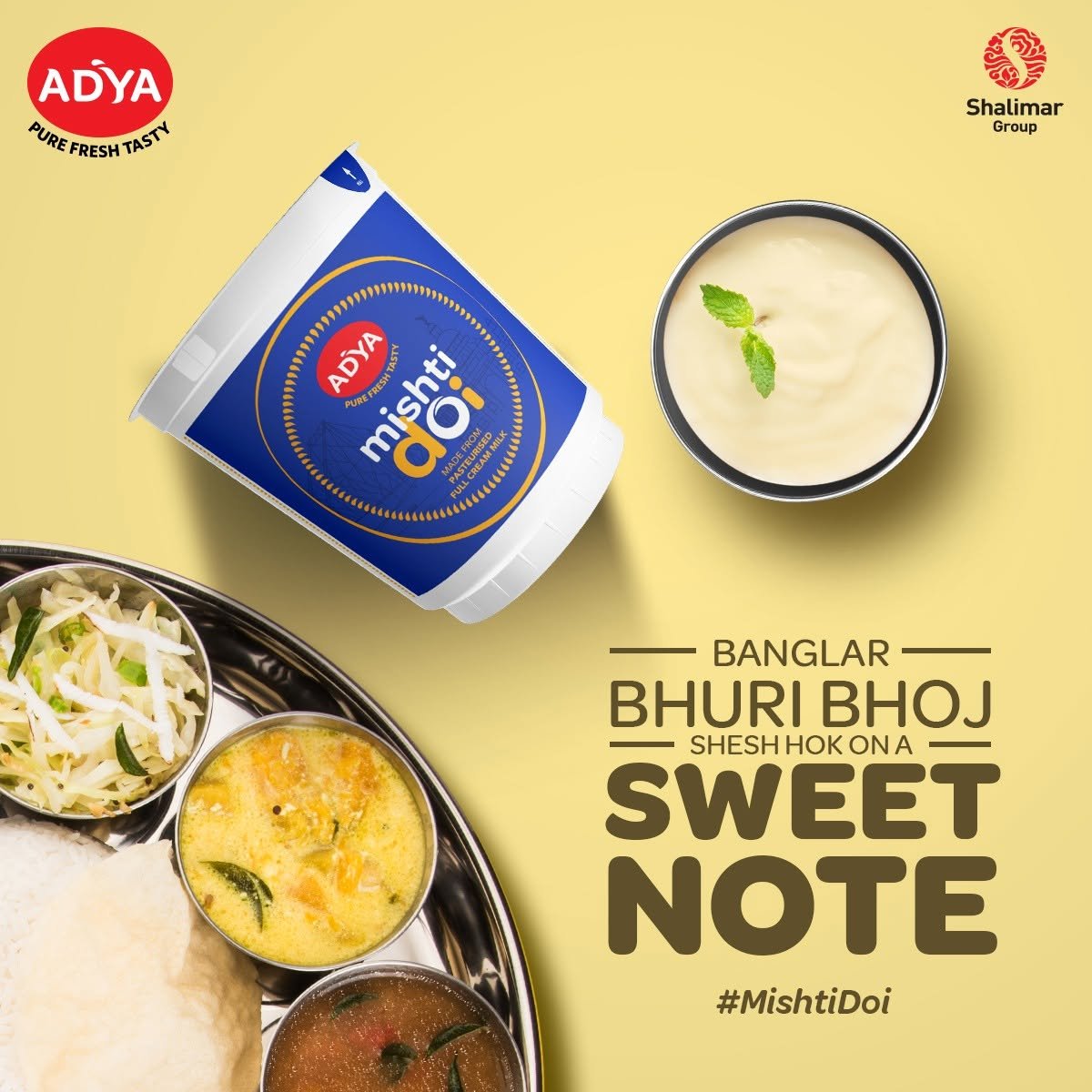 Adya Dairy Mishti Doi advertising creative featuring a Bengali meal platter, creamy sweet curd and the Banglar Bhuri Bhoj campaign message.