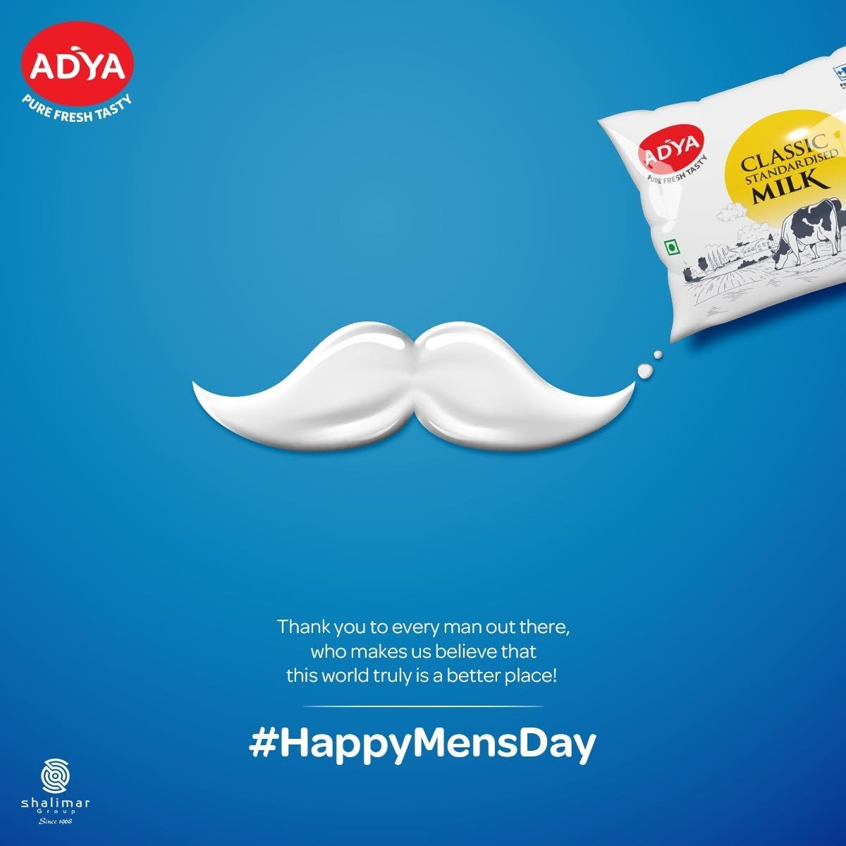 Adya Dairy Men's Day greeting featuring a white milk moustache on a blue background alongside Classic Standardised Milk packaging.