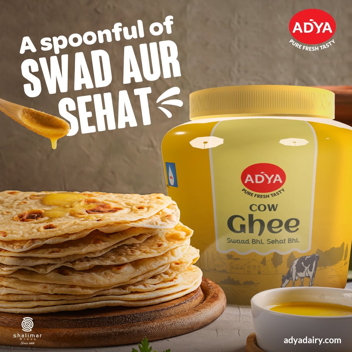 Adya Dairy Cow Ghee advertising creative featuring a jar of ghee, stacked parathas and a spoonful of golden ghee on a rustic background.